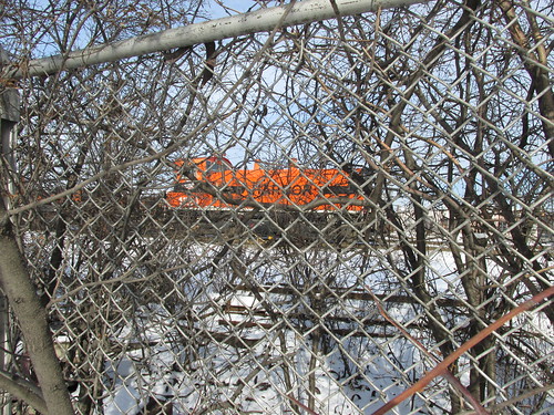 Indiana Harbor Belt Railroad diesel yard switcher idling behind the fence.  Argo Yard.  Summit Illinois.  January 2014. by Eddie from Chicago
