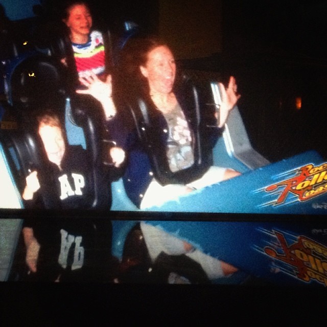 Taking Adam on rock N roller coaster. He loved it despite the horror on his face!