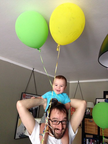 Elliott on Daddy's Head Playing with Balloons