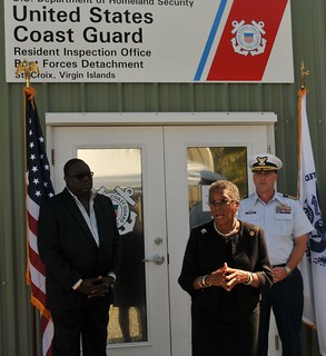 Congresswoman Donna Christensen addresses members of the press and invited guests during the inauguration of Coast Guard Resident Inspection Office and Boat Forces facilities Jan. 24, 2014 in Christiansted, St. Croix, U.S. Virgin Islands.  To the far right is Raymond Williams, U.S. Virgin Island Lieutenant General's Office Chief of Staff, and to the far right is Capt. Drew W. Pearson, Commander, U.S. Coast Guard Sector San Juan