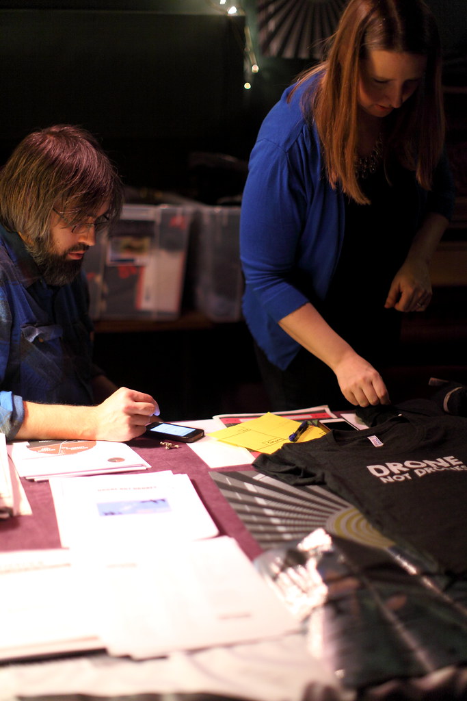 Luke and Jessica at the merch table