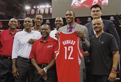 July 13, 2013 - Dwight Howard poses at his press conference with former Rocket players, including Yao Ming