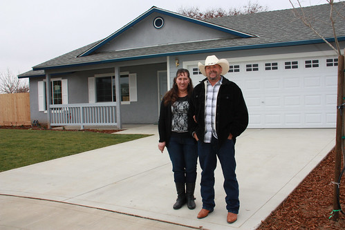 Maria and Ignacio Gordillo stand before their new home in Reedley, Calif. Along with 10 other families, the Gordillos helped build their house through USDA's Mutual Self-Help Housing Loan program in partnership with Self-Help Enterprises. (USDA photo)