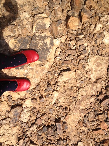 red shoes beside the Colorado River