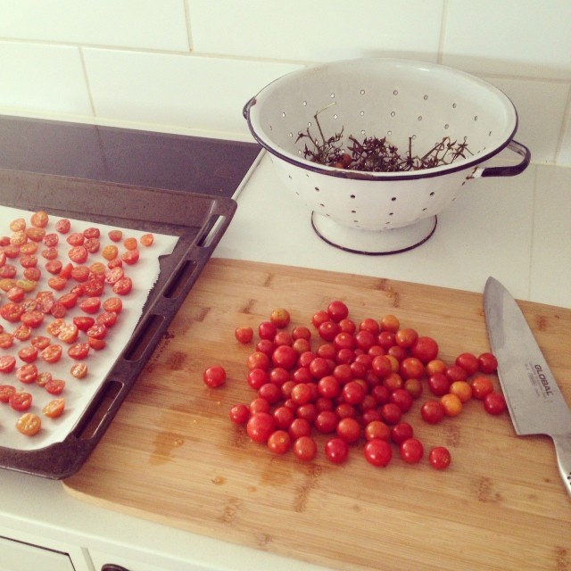 Yesterday's harvest is becoming 'sun-dried' tomatoes in olive oil. My pregnancy food addiction... #nomnomnom #preserving #cherrytomatoes #organic