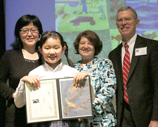 Margaret Yang with her Art From the Heart drawing with her mother Mei Li, Junior School Art Department Chair Nancy Jenkins and Headmaster Glen Shilling
