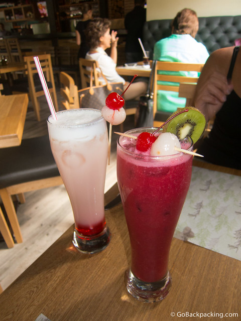 Tall servings of fresh fruit juices