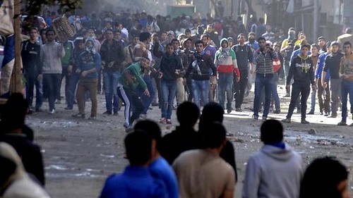 Egyptians clash with security forces in the southern Cairo district of Giza on Friday January 24, 2014. Nine people died in bombings and other unrest. by Pan-African News Wire File Photos