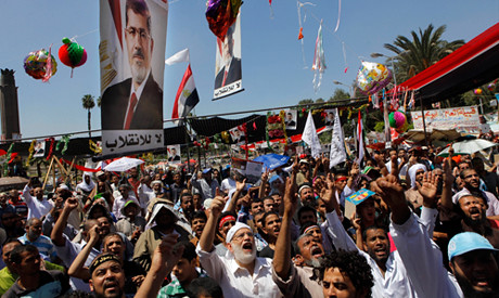 Crowds near Cairo University in pro-Morsi demonstration on Aug. 9, 2013. The supporters of the Freedom and Justice Party are demanding the return of ousted President Morsi. by Pan-African News Wire File Photos
