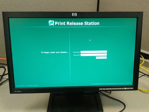 The print release station is a computer monitor between the printers.