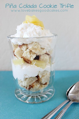 Piña Colada Cookie Trifle in glass with sppons.