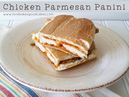 Chicken Parmesan Panini cut in half and stacked on plate.