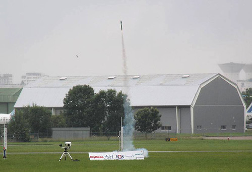 The American team's rocket streaks into the sky over Paris during the International Rocketry Challenge. The photo is courtesy Raytheon.