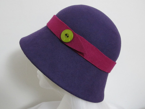 Purple felt cloche hat with pink felt band and lime green button