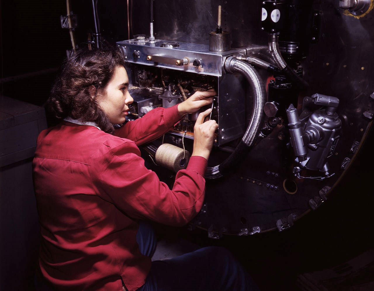 Switch boxes on the firewalls of B-25 bombers are assembled by women workers at North American Aviation, Inc's Inglewood, Calif, plant