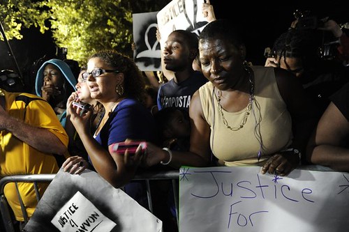 Demonstrators react to the not guilty verdict in the trial of George Zimmerman at the Seminole County Criminal Justice Center in Sanford, Florida, USA, 13 July 2013, after a jury acquitted him of all charges. by Pan-African News Wire File Photos
