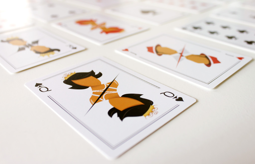 Queen of spades illustrated playing card with the deck out of focus in the background