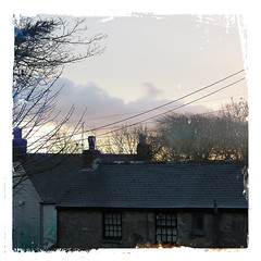 cottage rooftops and cornish skies