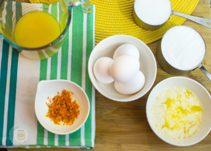 Melted butter, 4 white eggs, milk in measuring cups and other ingredients ready for prep