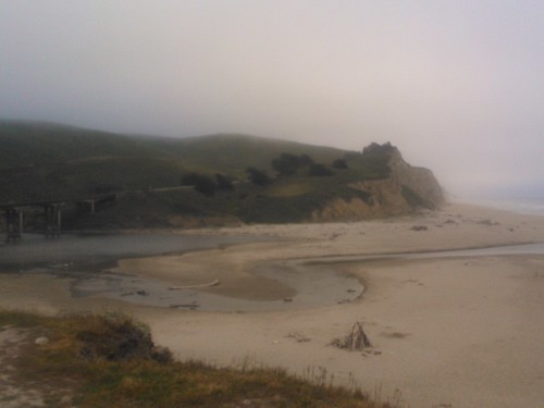 San Gregorio River in the fog, cliffs, sand estuary, San Gregorio State Beach, Pescadero, California, USA by Wonderlane