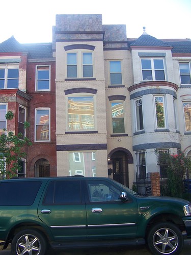 A recently constructed facade of stone, on an 1880s/1890s Victorian brick rowhouse, 800 block of H Street NEan 1890s