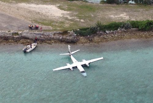 A downed twin engine aircraft is shown in the vicinity of Staniel Cay, Bahamas after the two people aboard attempted a precautionary landing Sunday Nov. 3, 2014. The two men were recovered and transported by a Coast Guard MH-60 Jayhawk helicopter crew from Air Station Clearwater, Fla., to Nassau with no injures. U.S. Coast Guard photo