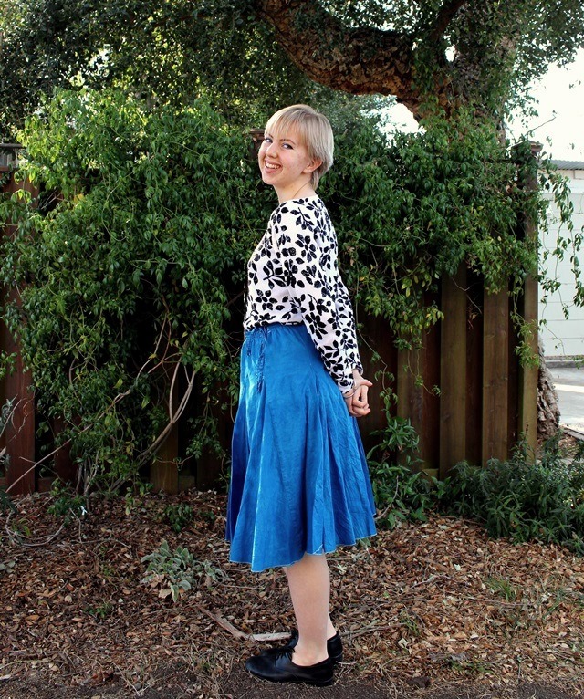 black-and-white floral blouse, bright blue midi skirt