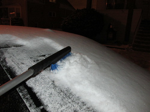 Brushing snow off the rear car window after an overnight snowstorm. Elmwood Park Illinois. Thursday, December 26th, 2013. by Eddie from Chicago