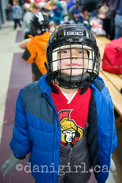  photo of little boy skating lesson hockey gear 