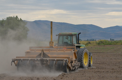 One of Reggie Premo’s alfalfa fields being laser leveled, which allows for a more even and efficient distribution of water across a field. USDA photo.