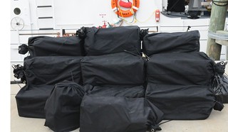 Twenty bales of cocaine are shown at Coast Guard Sector St. Petersburg, Fla., Thursday, Nov. 7, 2013. The crew of the Coast Guard Cutter Sitkinak, homeported in Miami, transported the $19 million estimated wholesale value of contraband to the sector after it was seized in the Caribbean Sea in support of Operation Martillo. U.S. Coast Guard photo by Petty Officer 1st Class Crystalynn A. Kneen