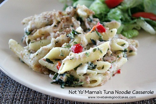 Tuna Noodle Casserole on white plate with green salad.