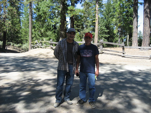 Eduardo Olmedo (left), Grindstone District Ranger, and Kenneth Wright, Round Valley Indian Tribes President, enjoy the shade after a morning of hiking the Nome Cult trail on the Mendocino National Forest. (U.S. Forest Service/Denise Adamic)