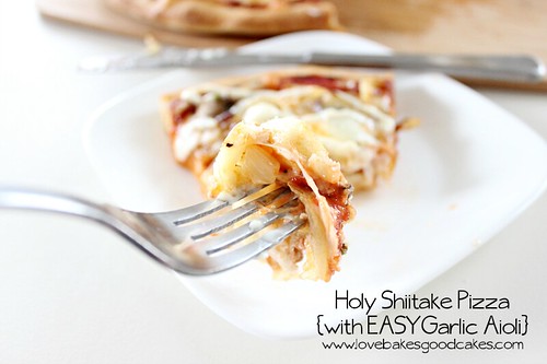 Copycat Holy Shiitake Pizza {with EASY Garlic Aioli} slice on white plate with fork.