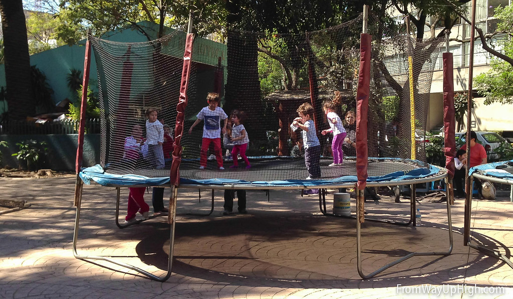 Kids jump on a trampoline in Parque Mexico, Xexico City