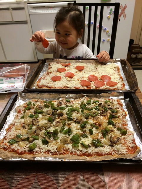 Mio topping the pizza
