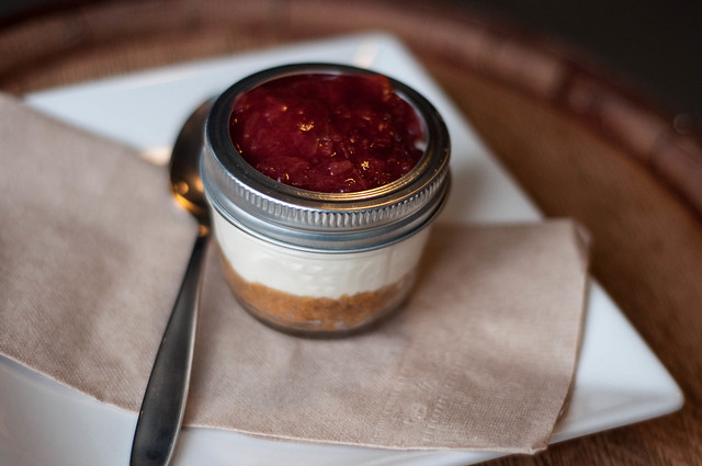 cheesecake in a jar with rhubarb and raspberry topping