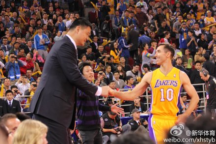 October 15, 2013 - Yao Ming and Steve Nash greet each other at a preseason game in Beijing
