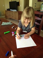 Emily works on a letter to Aunt Rachel and Uncle Mark in Hawaii
