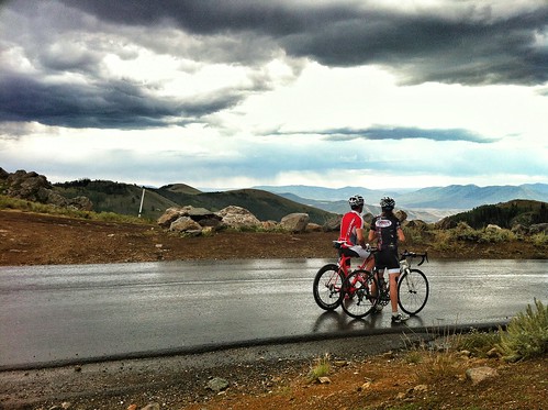 Cyclists atop a rainy Empire Pass