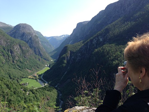 Joan takes a picture of a mountain gorge near Stalheim Norway