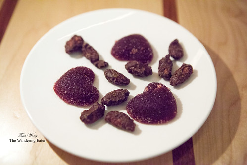 Petit fours of chocolate coated almonds and heart-shaped cherry pâte de fruits