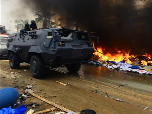 Egyptian military forces storm encampments protesting the coup killing hundreds and setting fire to tents. The latest massacre took place on August 14, 2013. by Pan-African News Wire File Photos