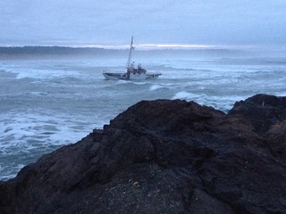 Coast Guard Station Yaquina Bay, Ore., and Incident Management Division from Sector Columbia River, Ore., respond to a fishing vessel that ran aground approximately 50 yards south of Yaquina Bay, Dec. 14, 2013. (Photo by U.S. Coast Guard)