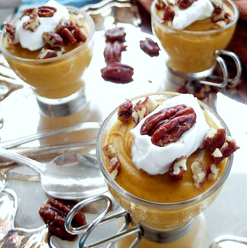 Maple Pumpkin Pudding in individual serving cups on a silver platter, ready for serving.
