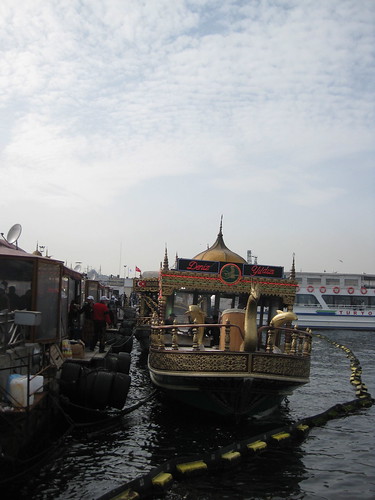 Boats along the Bosporus selling fish sandwiches with the Süleymaniye Mosque in the background