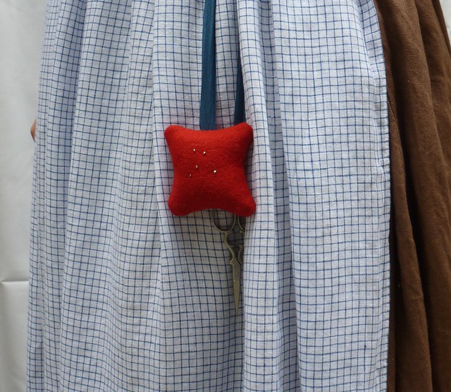red wool square pincushion/"pinball"