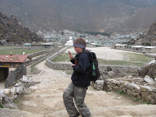 Me standing outside of Khumjung doing a karate pose