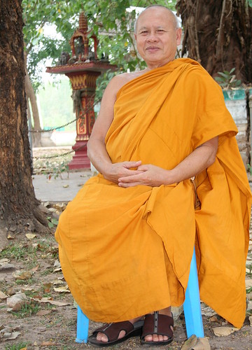 Monk waiting for the ceremony 2 by tGenteneeRke langs de Mekong