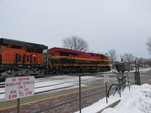 Eastbound BNSF Railway freight train with a Kansas City Southern Railroad locomotive up front.  Riverside Illinois.  December 2013. by Eddie from Chicago